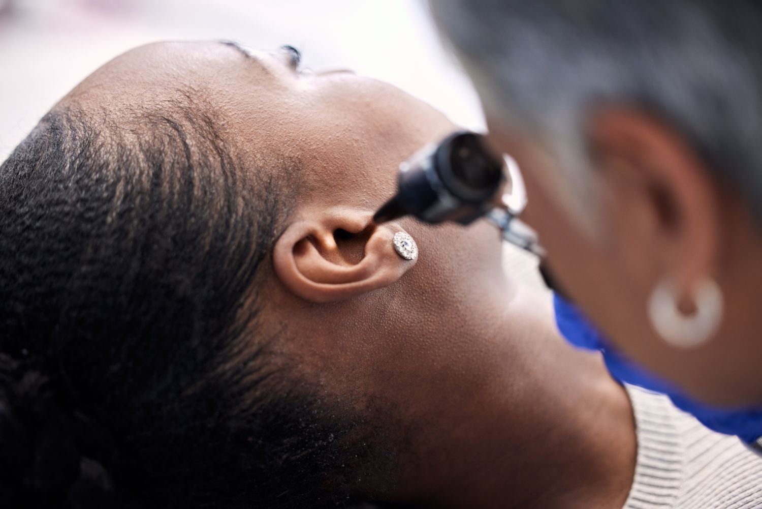 woman getting her ear checked